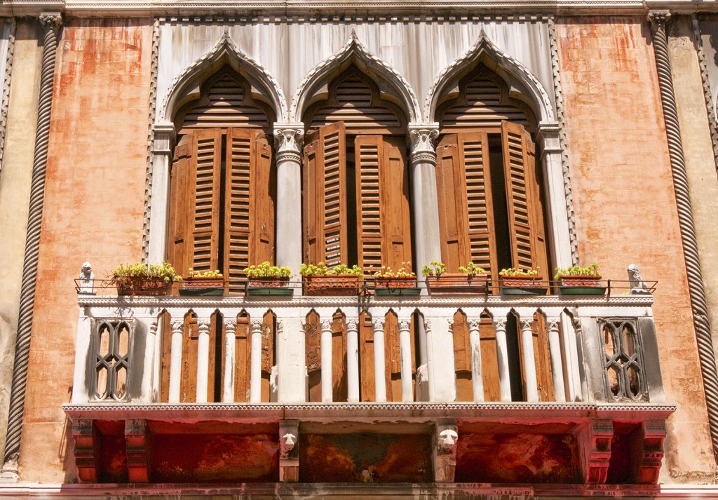 Shutters and balcony of building in Venice, Italy