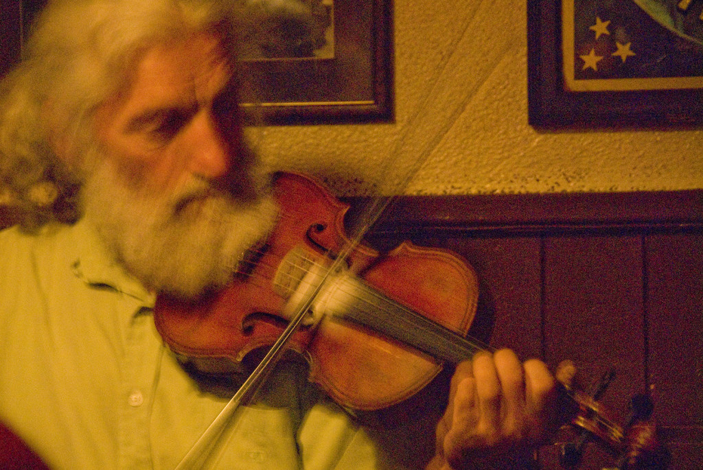 Man playing fiddle in pub, Westport, County Mayo, Ireland