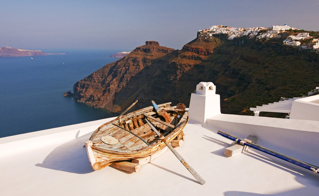 Old wooden rowboat on rooftop, Fira (Thira), Santorini, Greece