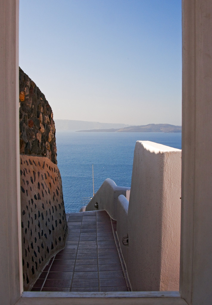 View through doorway to Aegean Sea, Oia, Santorini, Greece