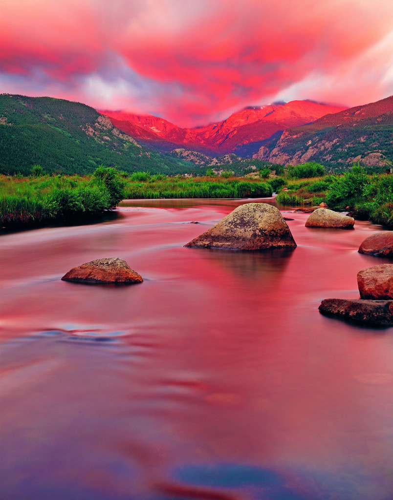 Pink sunrise at Rocky Mountain National Park with the Big Thompson River in the foreground, Colorado