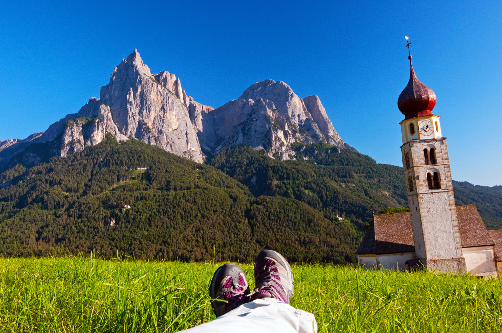 View of the Dolomites from meadow in Alpe di Siusi area, near the town of Suisi, Italy