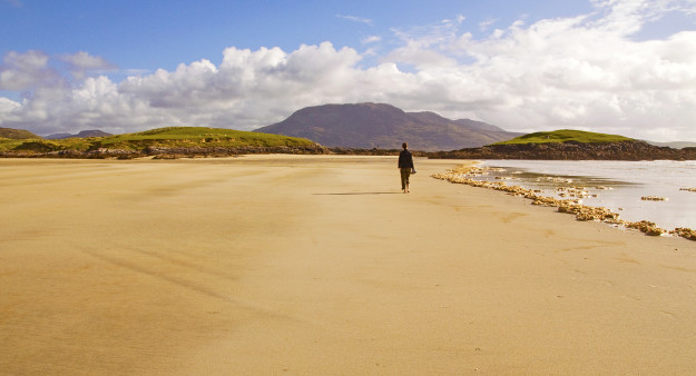 Woman on beach in Ireland